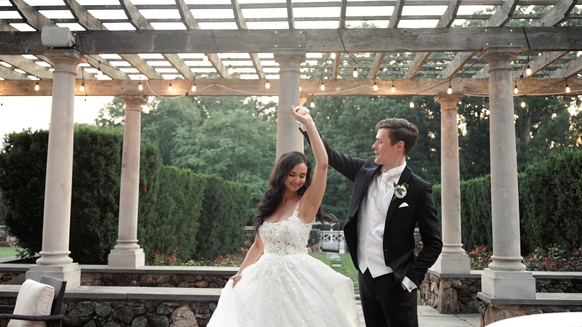 Groom twirls his new bride